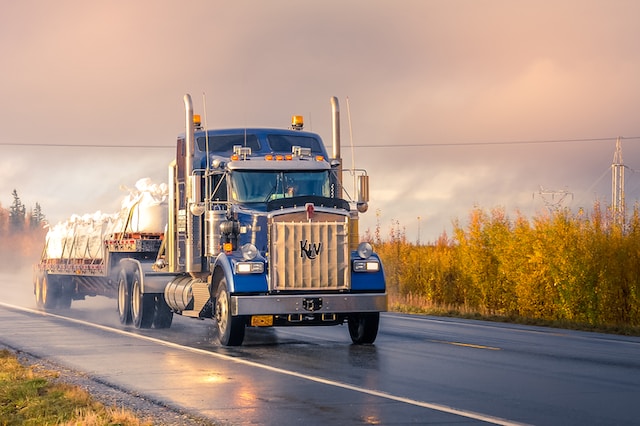 mcm logisticks semy truck hauling flatbed loads